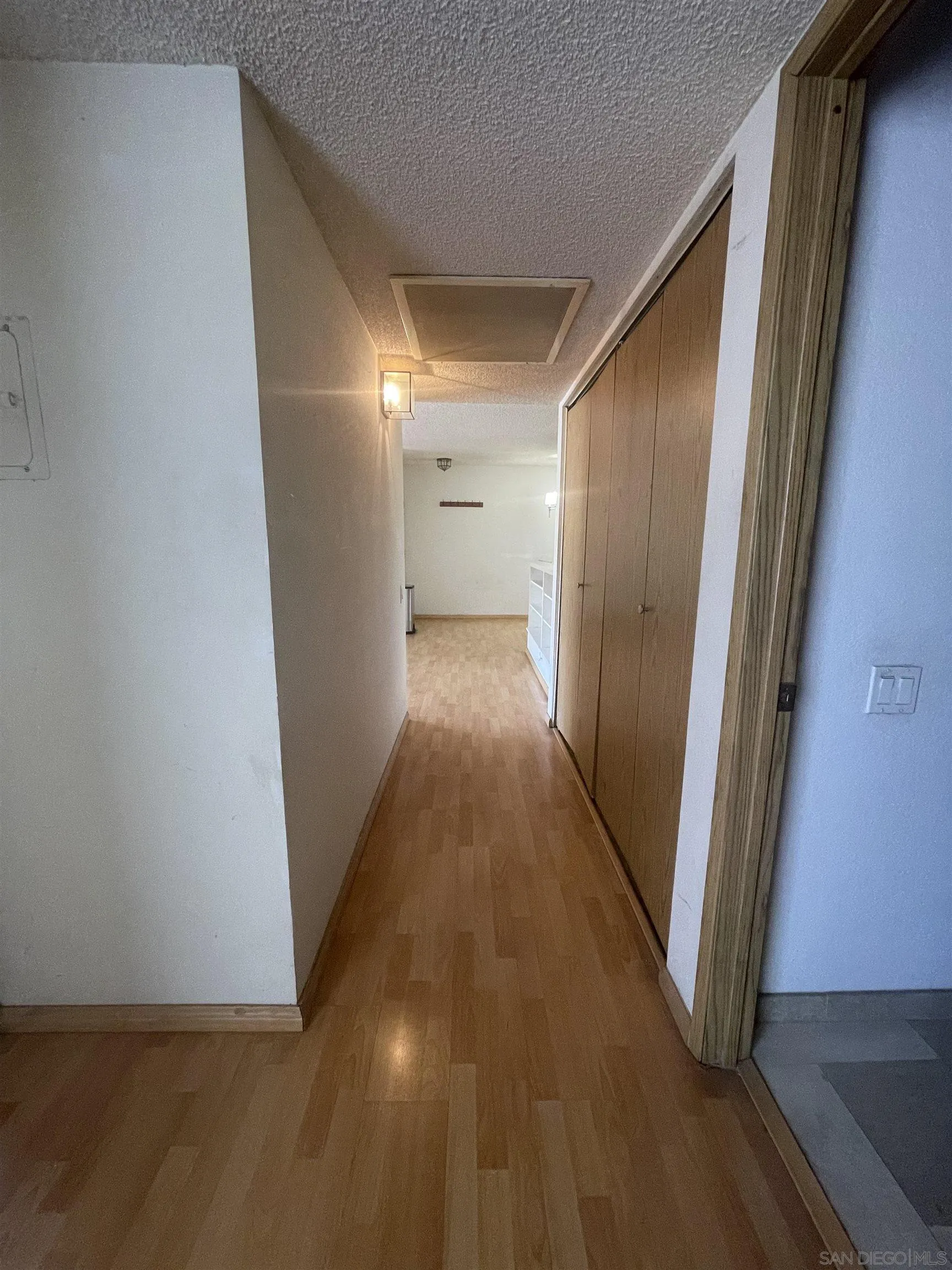 21921 Rimhurst Drive, Unit 130G Lake Forest, CA 92630 - Photo 4 of 9 a view of a hallway with wooden floor