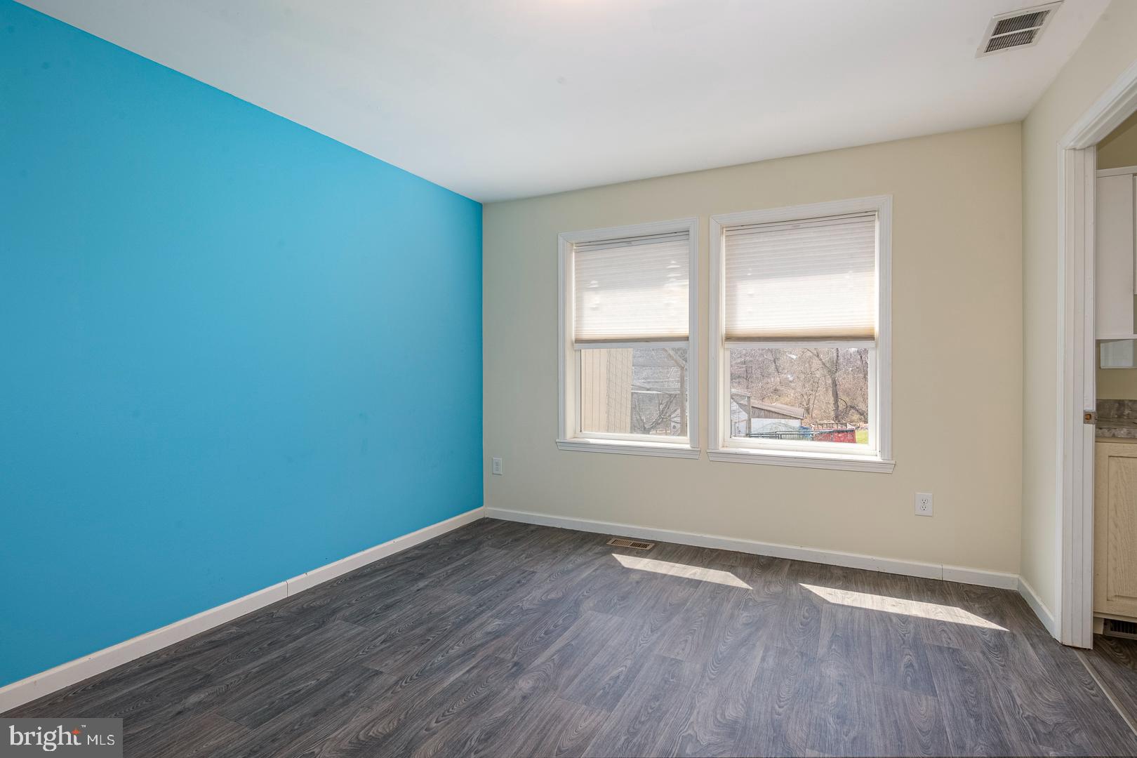 25 Thaddeus Lane Reading, PA 19606 - Photo 13 of 36 an empty room with wooden floor and windows
