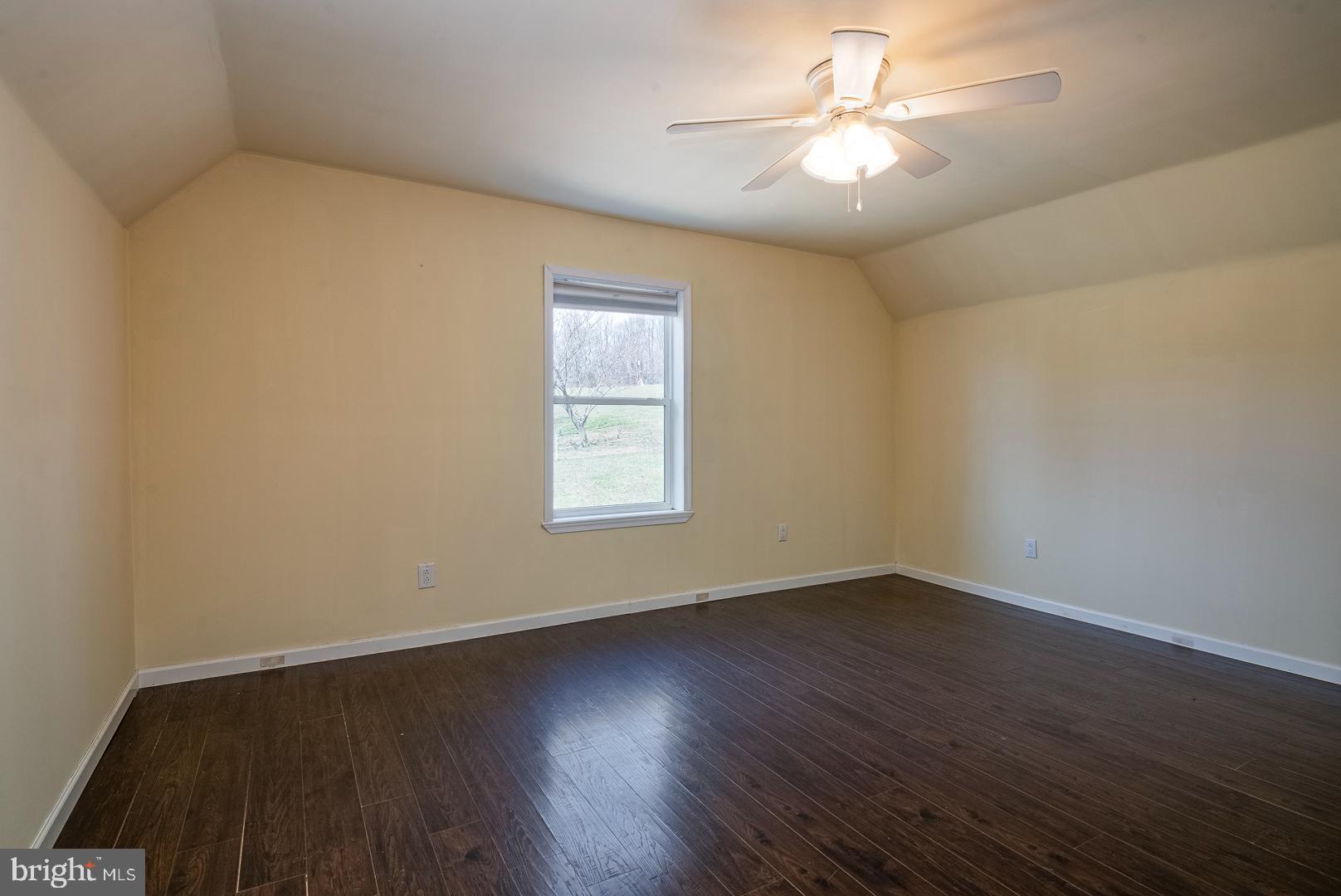25 Thaddeus Lane Reading, PA 19606 - Photo 15 of 36 a view of an empty room with window and wooden floor