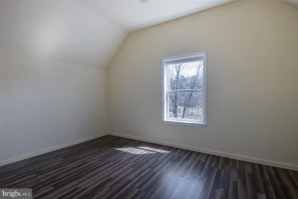 a view of snow on the side of a road