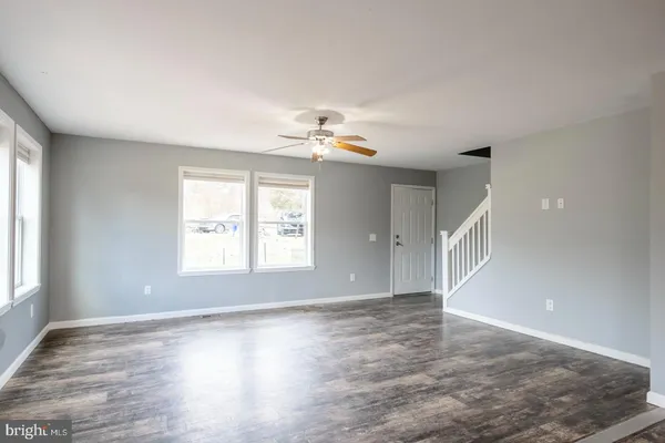 a view of empty space with wooden fence