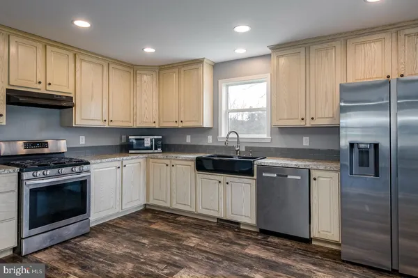 a view of a park with large trees