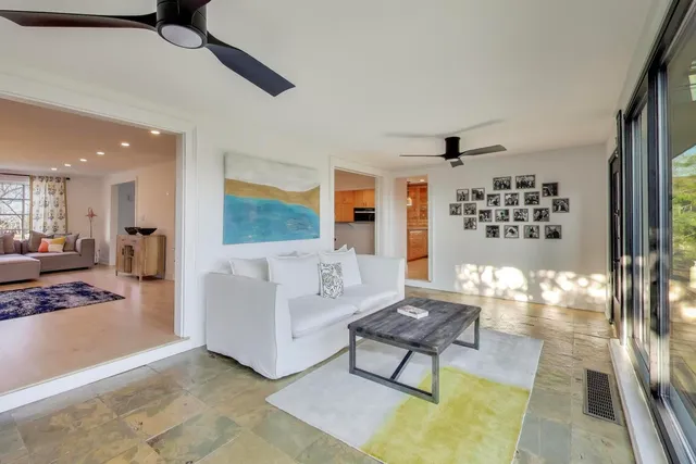 a living room with furniture and a rug