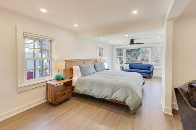 a bedroom with bed and window