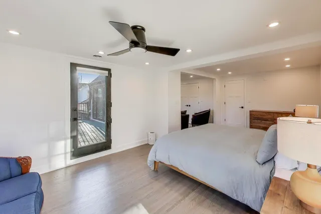 a bedroom with a bed and a couch