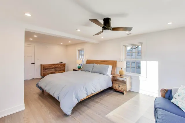 a bed room with a bed and a couch