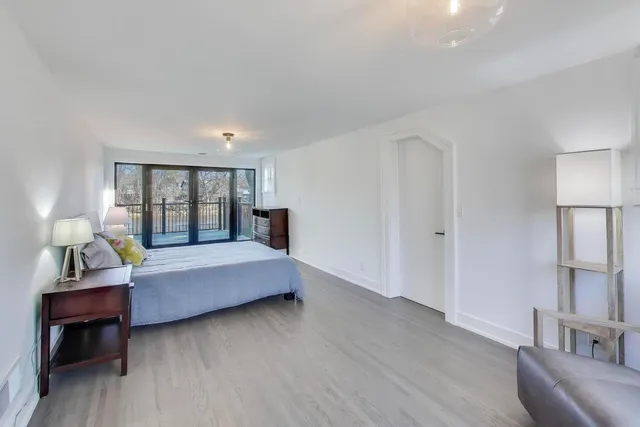 a bathroom with a sink toilet a mirror and shower
