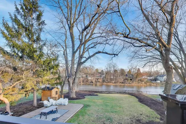 a swimming pool view with a large garden