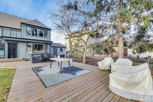 a view of a swimming pool with a patio and a yard