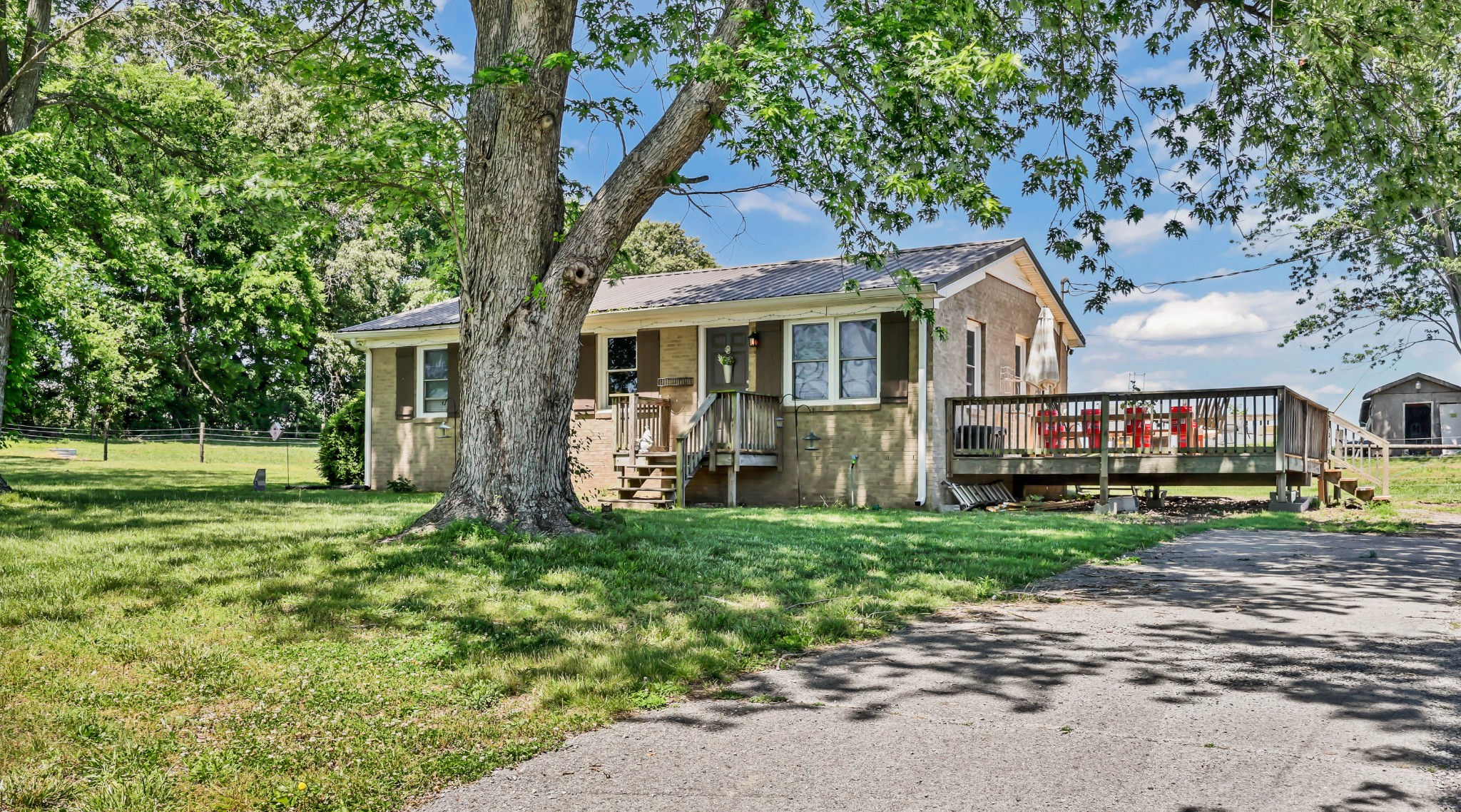 1068 Hugh Hunter Road Oak Grove, KY 42262 - Photo 4 of 30 a front view of a house with a garden
