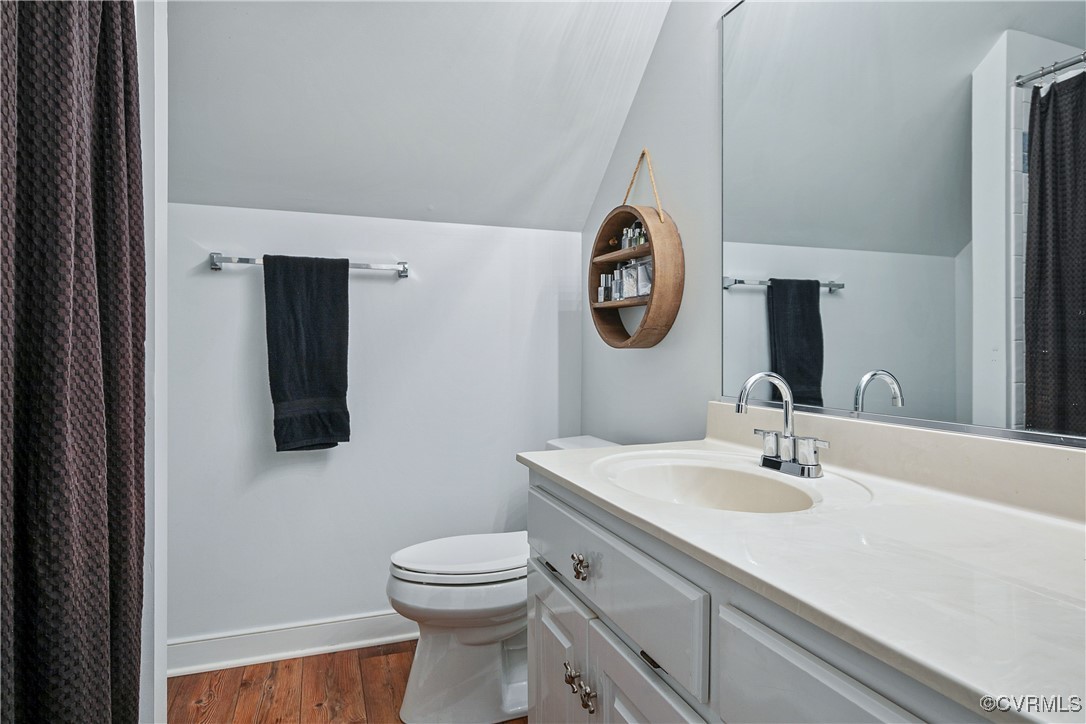 8910 Cardiff Road Chesterfield, VA 23236 - Photo 42 of 48 a bathroom with a toilet sink and mirror