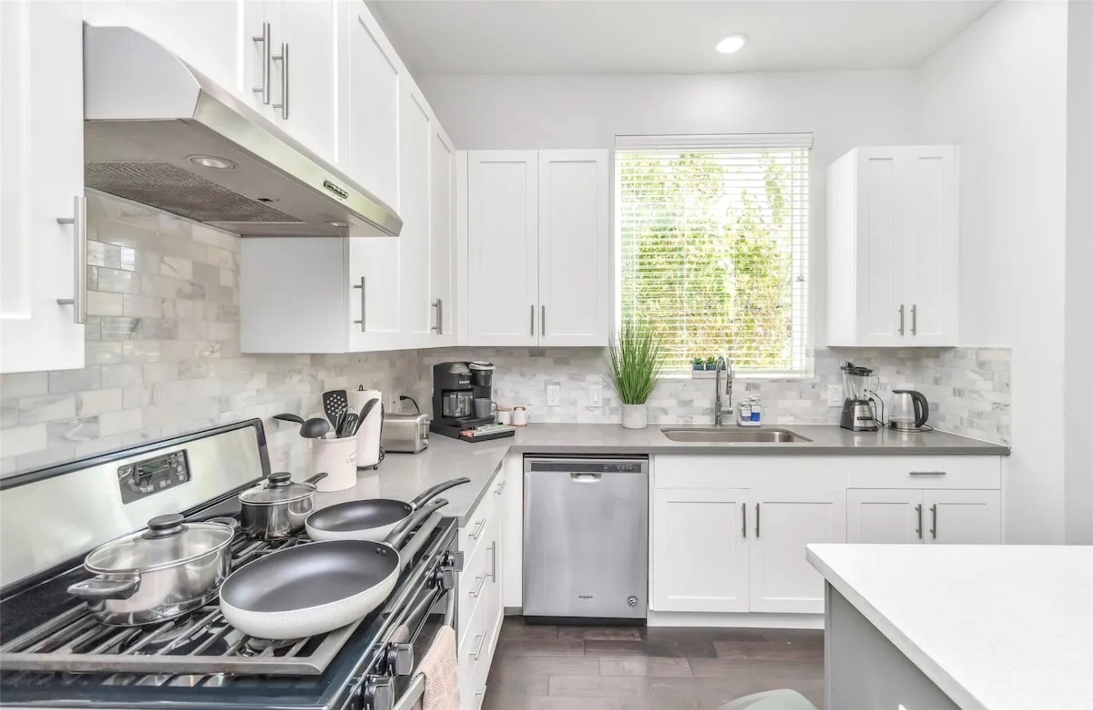 2817 Palm Street Houston, TX 77004 - Photo 11 of 18 a kitchen with a sink stove top oven and cabinets
