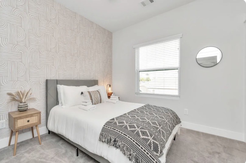 2817 Palm Street Houston, TX 77004 - Photo 4 of 18 a bedroom with a bed and a window