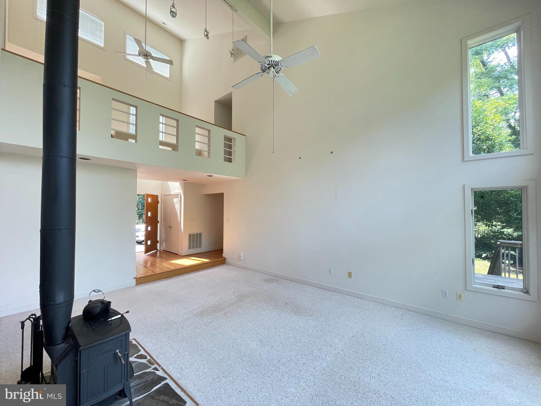 26 Cannon Bluff Drive Stafford, VA 22554 - Photo 16 of 24 wooden floor in a hall with a window