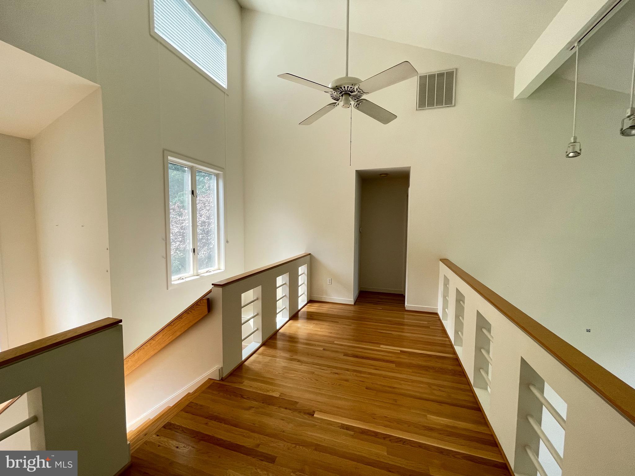 26 Cannon Bluff Drive Stafford, VA 22554 - Photo 22 of 24 a view of a hallway with wooden floor and staircase