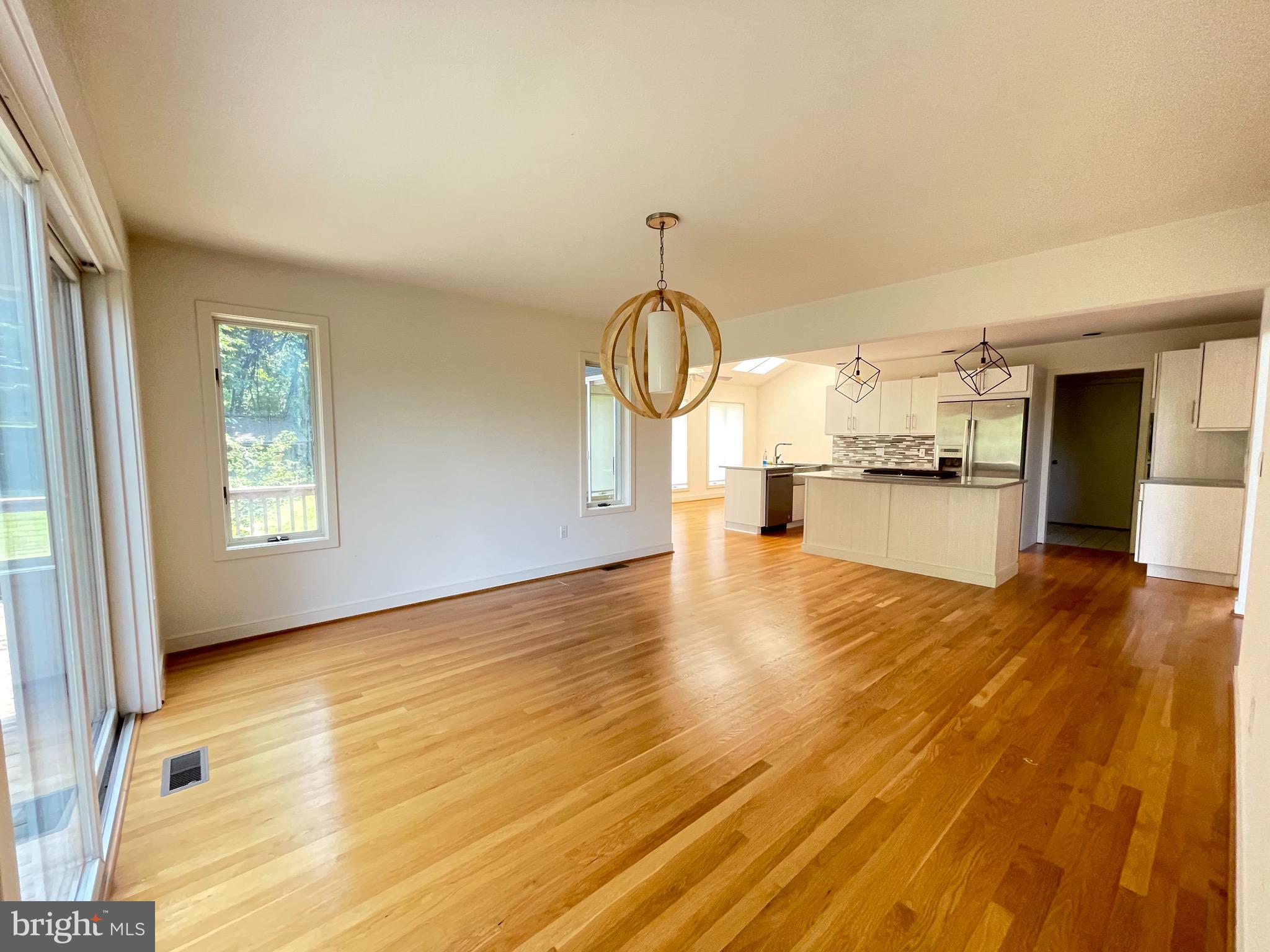 26 Cannon Bluff Drive Stafford, VA 22554 - Photo 6 of 24 a view of empty room with wooden floor and window