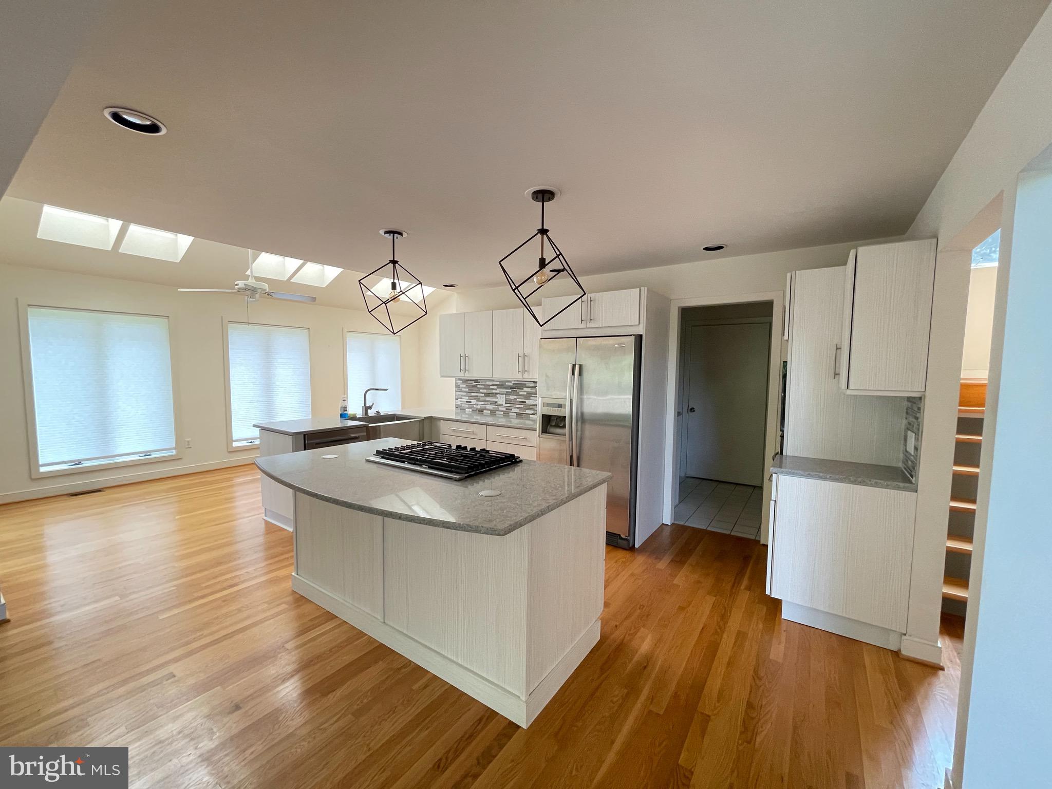 26 Cannon Bluff Drive Stafford, VA 22554 - Photo 7 of 24 a kitchen with stove a refrigerator and wooden floor