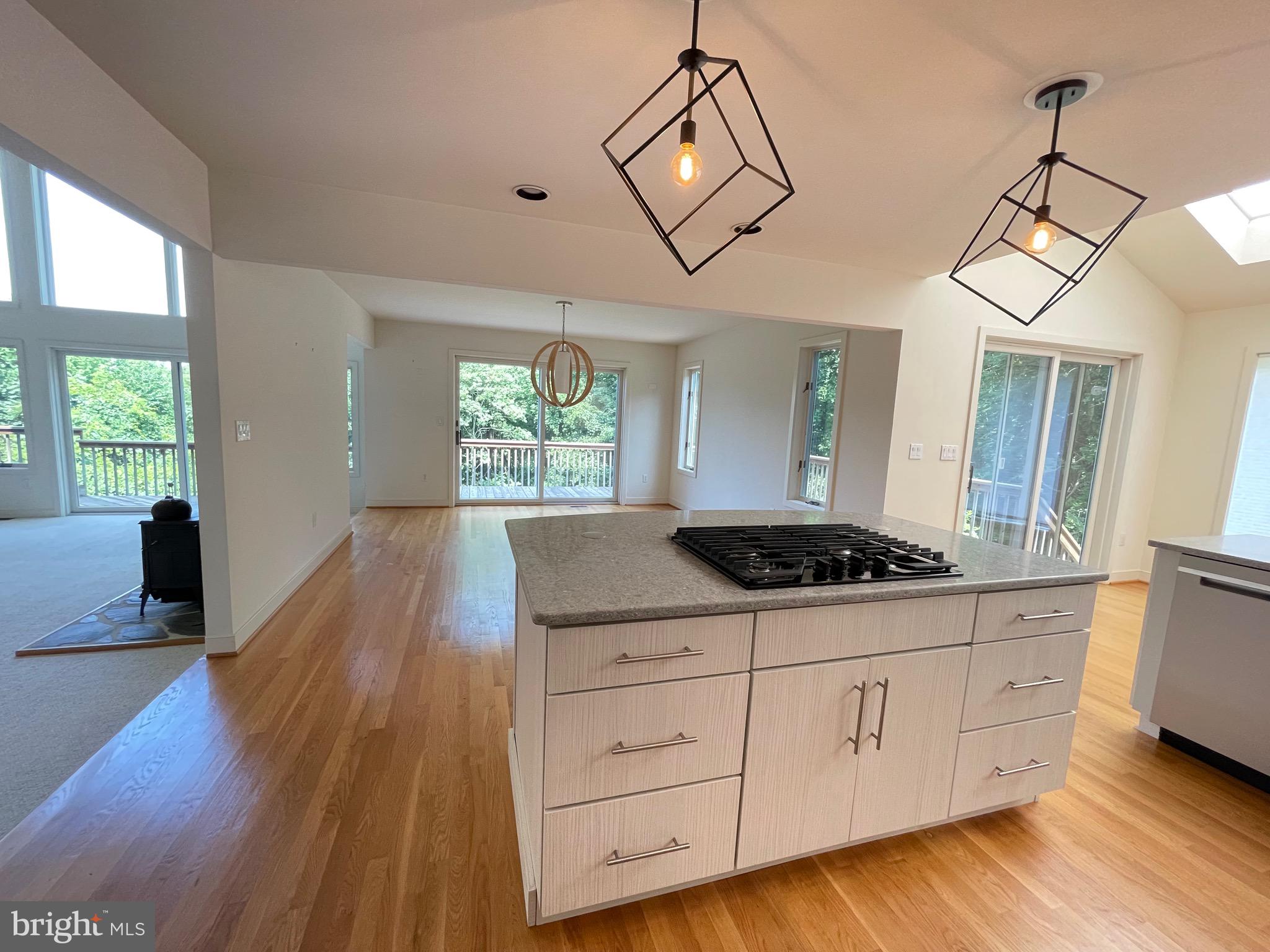 26 Cannon Bluff Drive Stafford, VA 22554 - Photo 9 of 24 a kitchen with stainless steel appliances granite countertop a stove a sink dishwasher and white cabinets with wooden floor