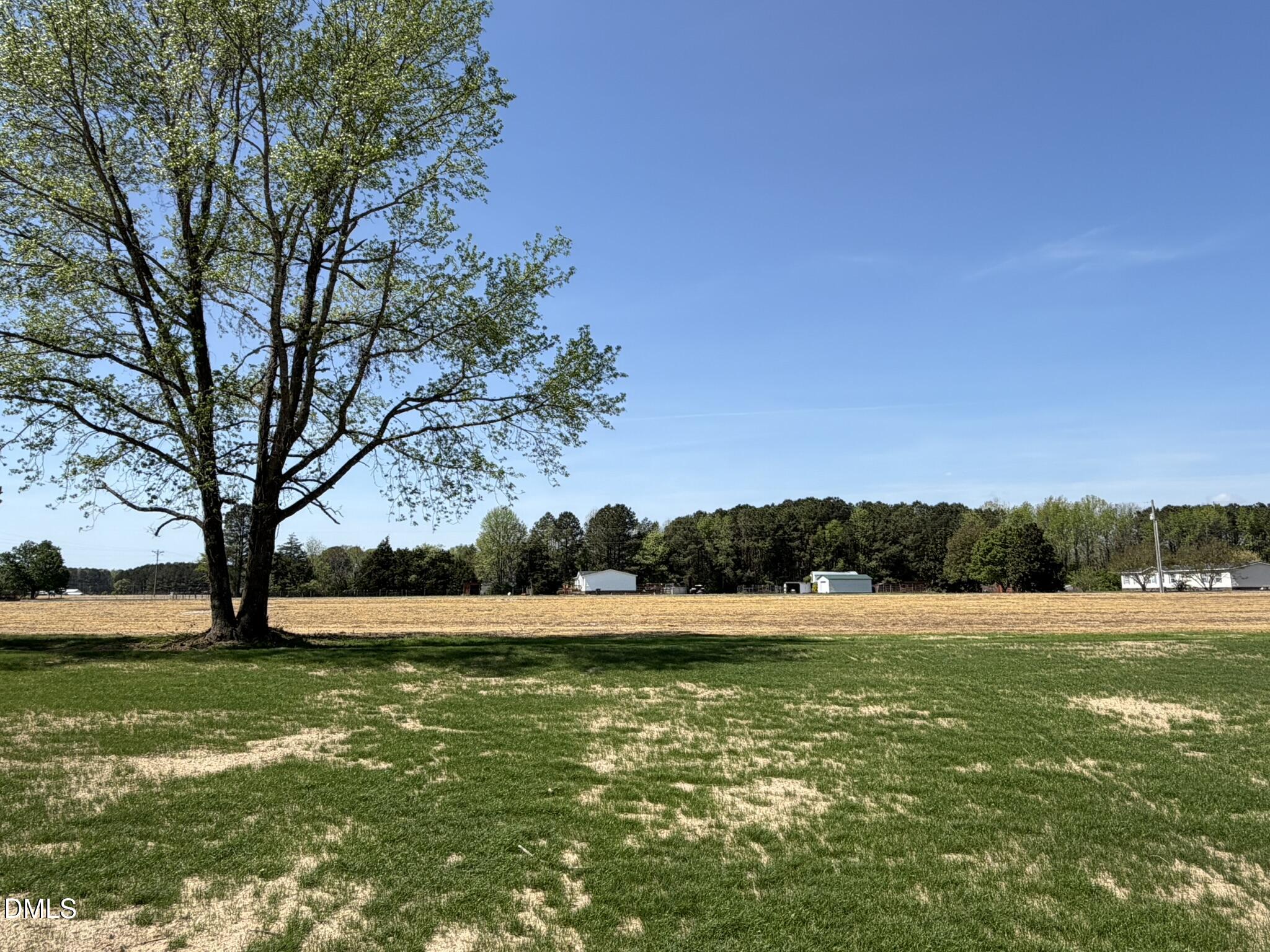 25 Jacobs Ridge Drive Four Oaks, NC 27524 - Photo 17 of 18 a view of outdoor space with green field and trees
