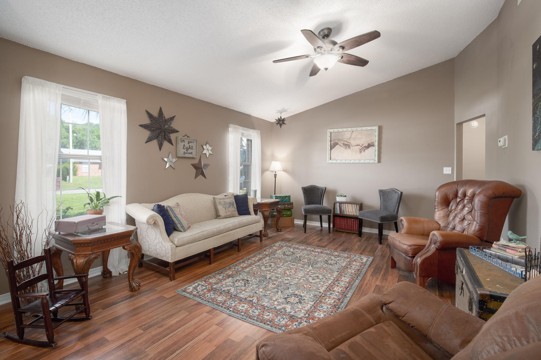 2774 Augustus Road Navarre, FL 32566 - Photo 3 of 18 a living room with furniture two lamps and a large window