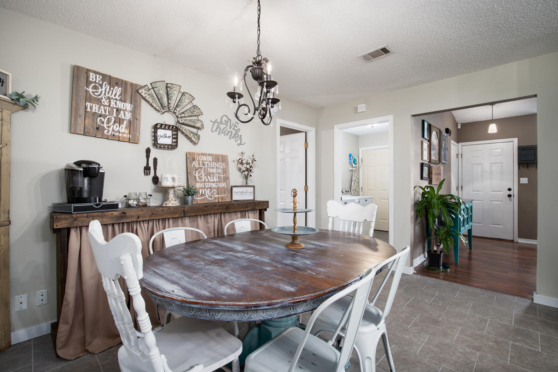 2774 Augustus Road Navarre, FL 32566 - Photo 6 of 18 a dining room with furniture and wooden floor