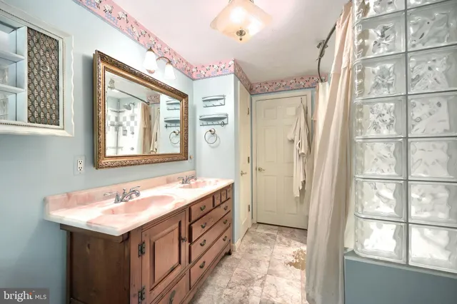 an empty room with furniture and a window