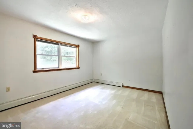 a bathroom with a sink a toilet a mirror and shower