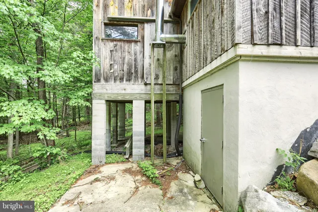 a view of a green field with lots of bushes