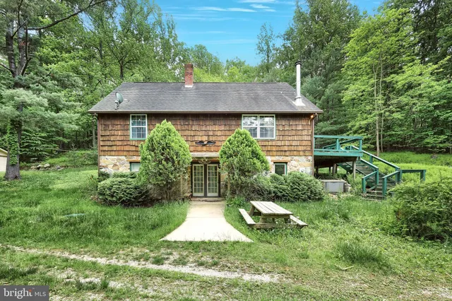 a bathroom with a sink mirror and a shower