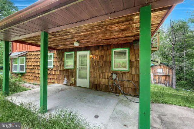 a kitchen with stainless steel appliances granite countertop a stove a sink dishwasher a refrigerator and a microwave