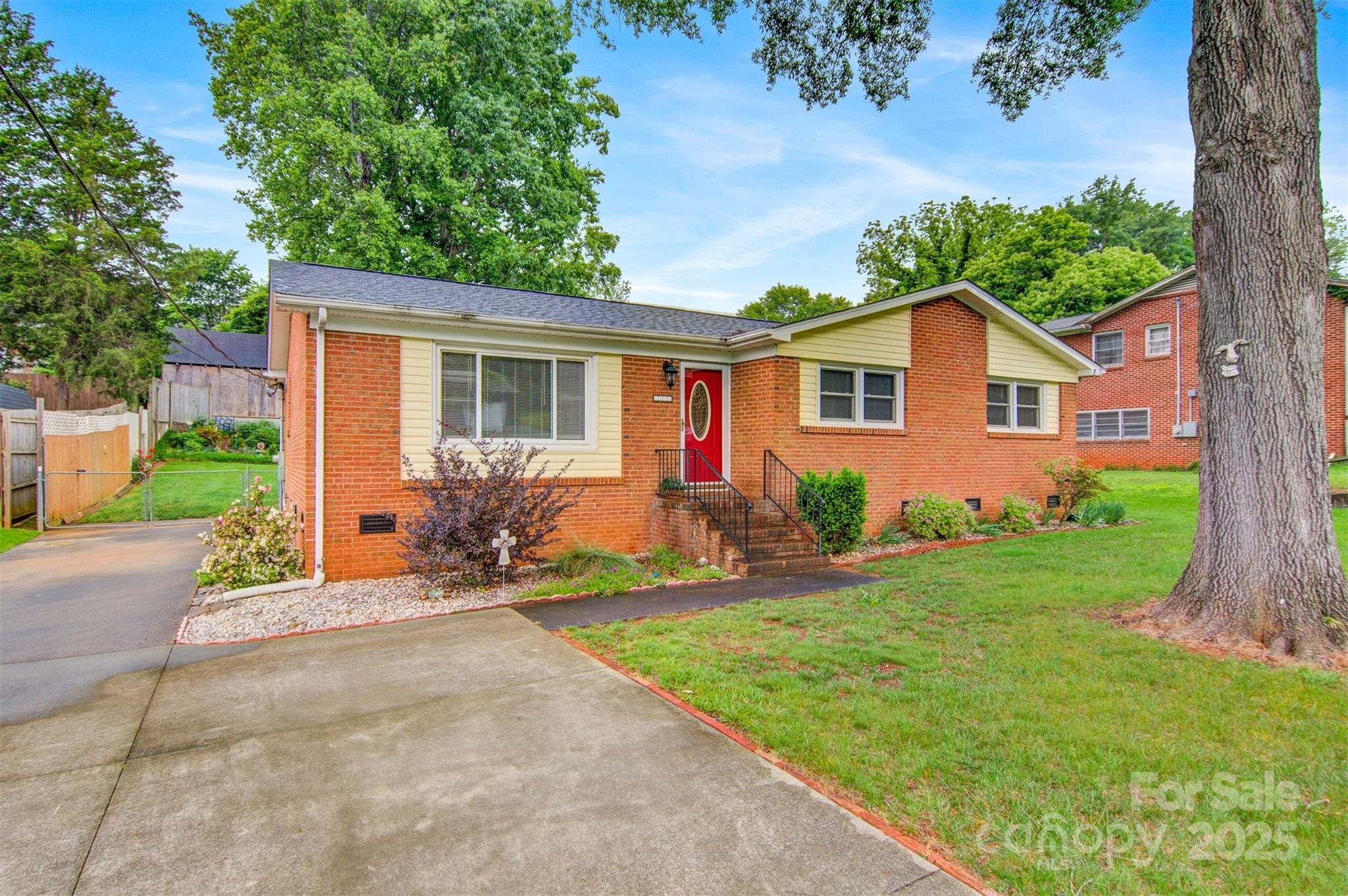 a front view of house with yard and green space