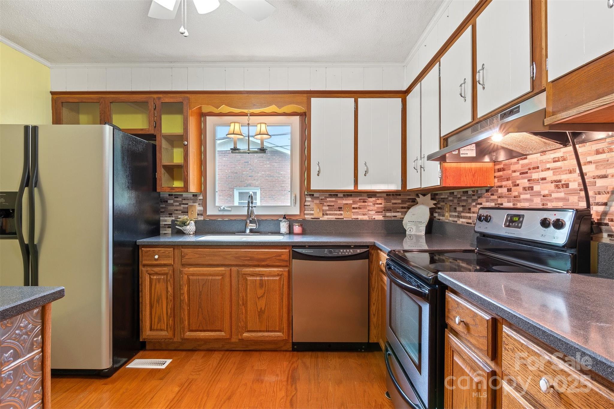 1405 8th Avenue Northwest Conover, NC 28613 - Photo 11 of 41 a kitchen with stainless steel appliances granite countertop a refrigerator a sink and a stove
