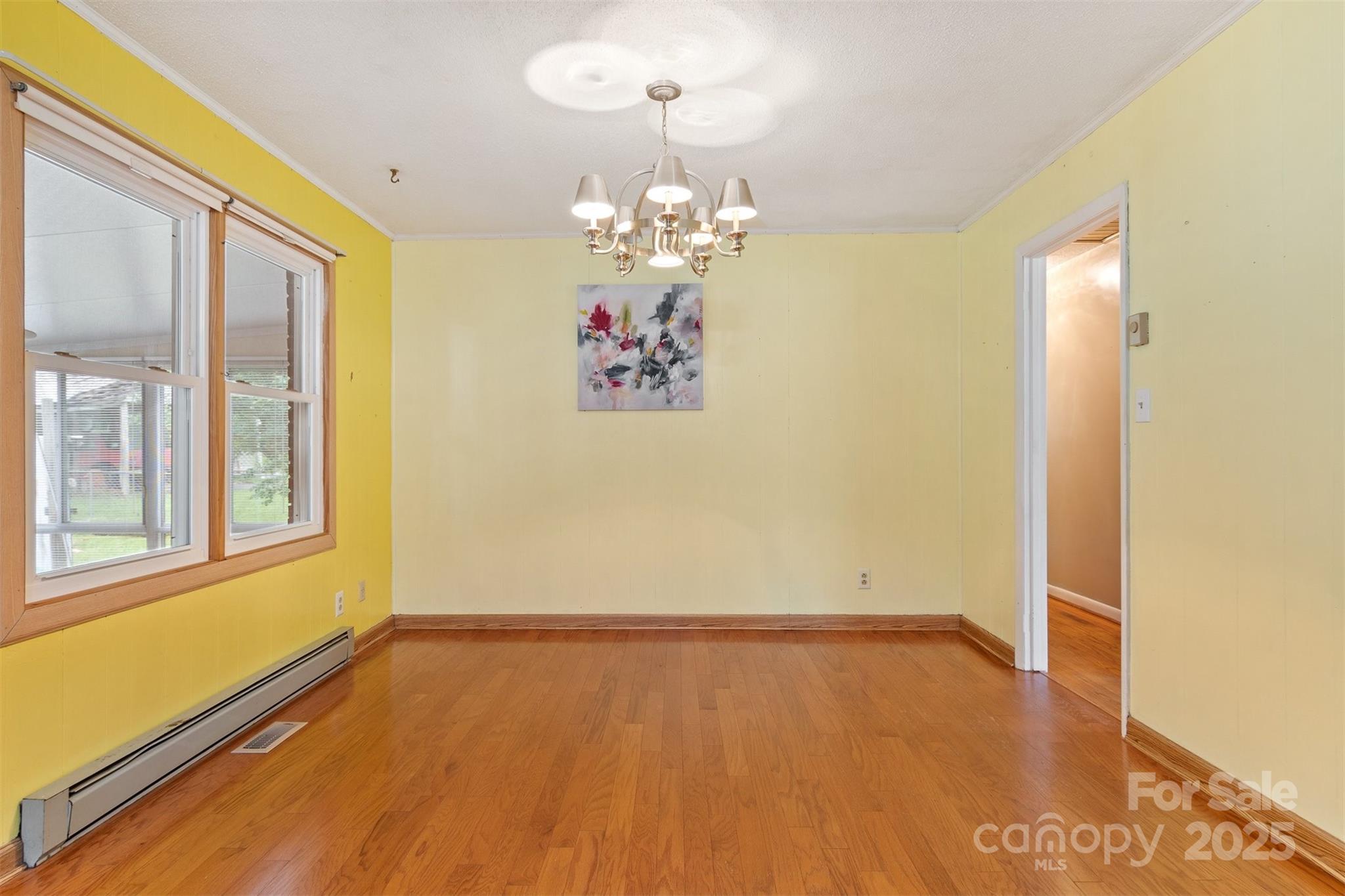 1405 8th Avenue Northwest Conover, NC 28613 - Photo 16 of 41 wooden floor in an empty room with a window