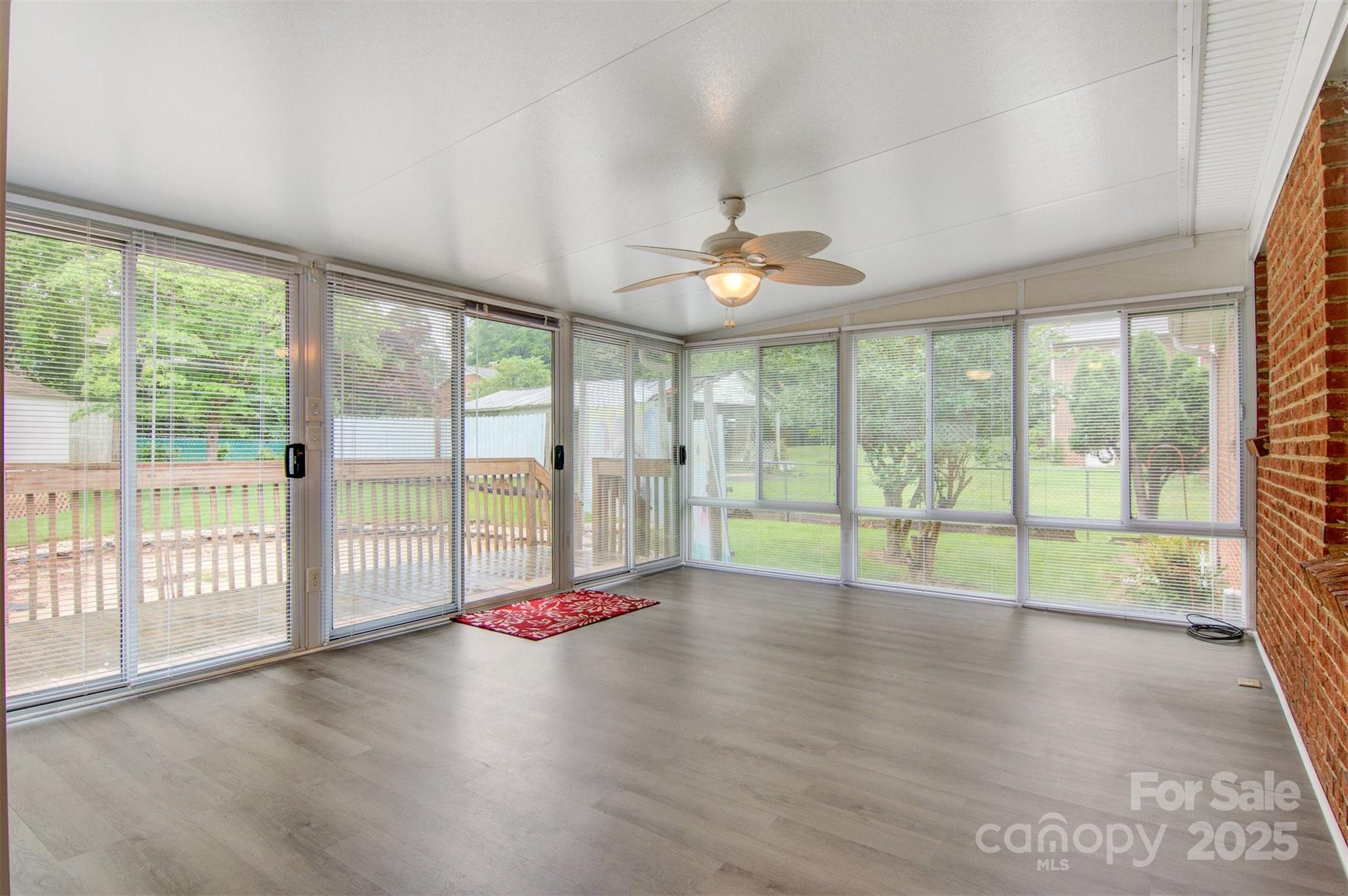 1405 8th Avenue Northwest Conover, NC 28613 - Photo 18 of 41 a view of empty room with wooden floor and fan