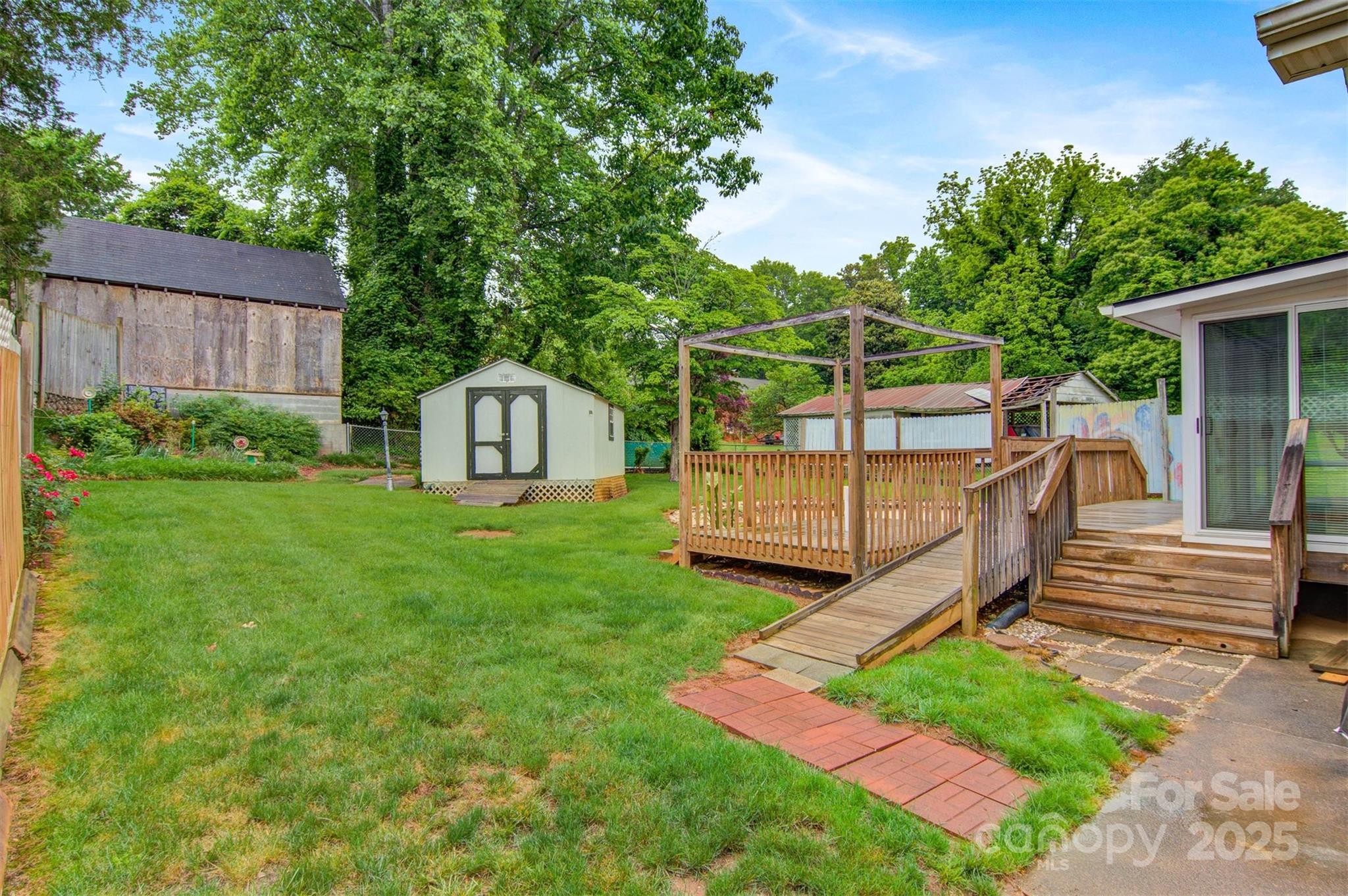 1405 8th Avenue Northwest Conover, NC 28613 - Photo 34 of 41 a view of a backyard with a slide