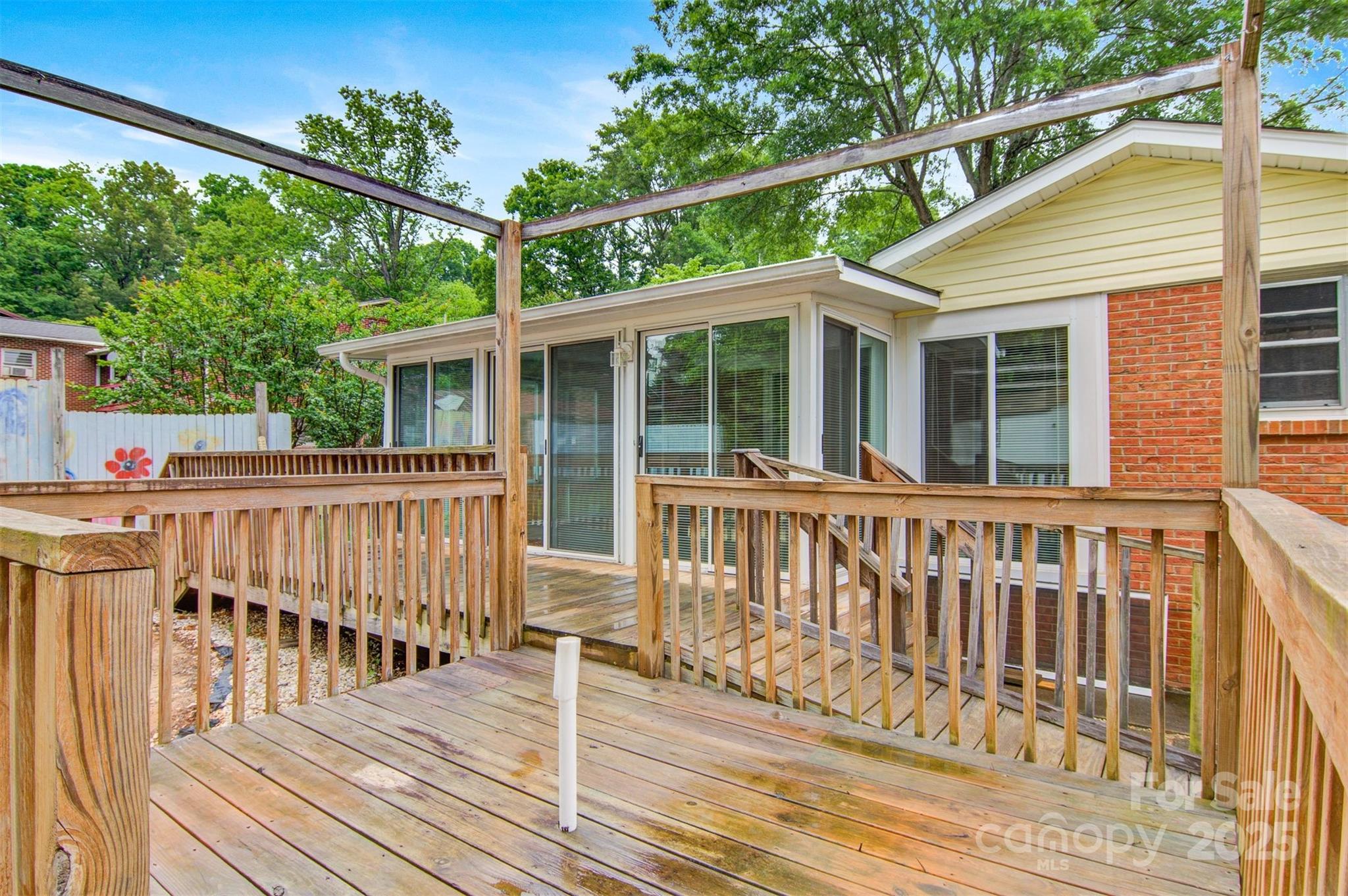 1405 8th Avenue Northwest Conover, NC 28613 - Photo 38 of 41 a view of a wooden deck and a yard