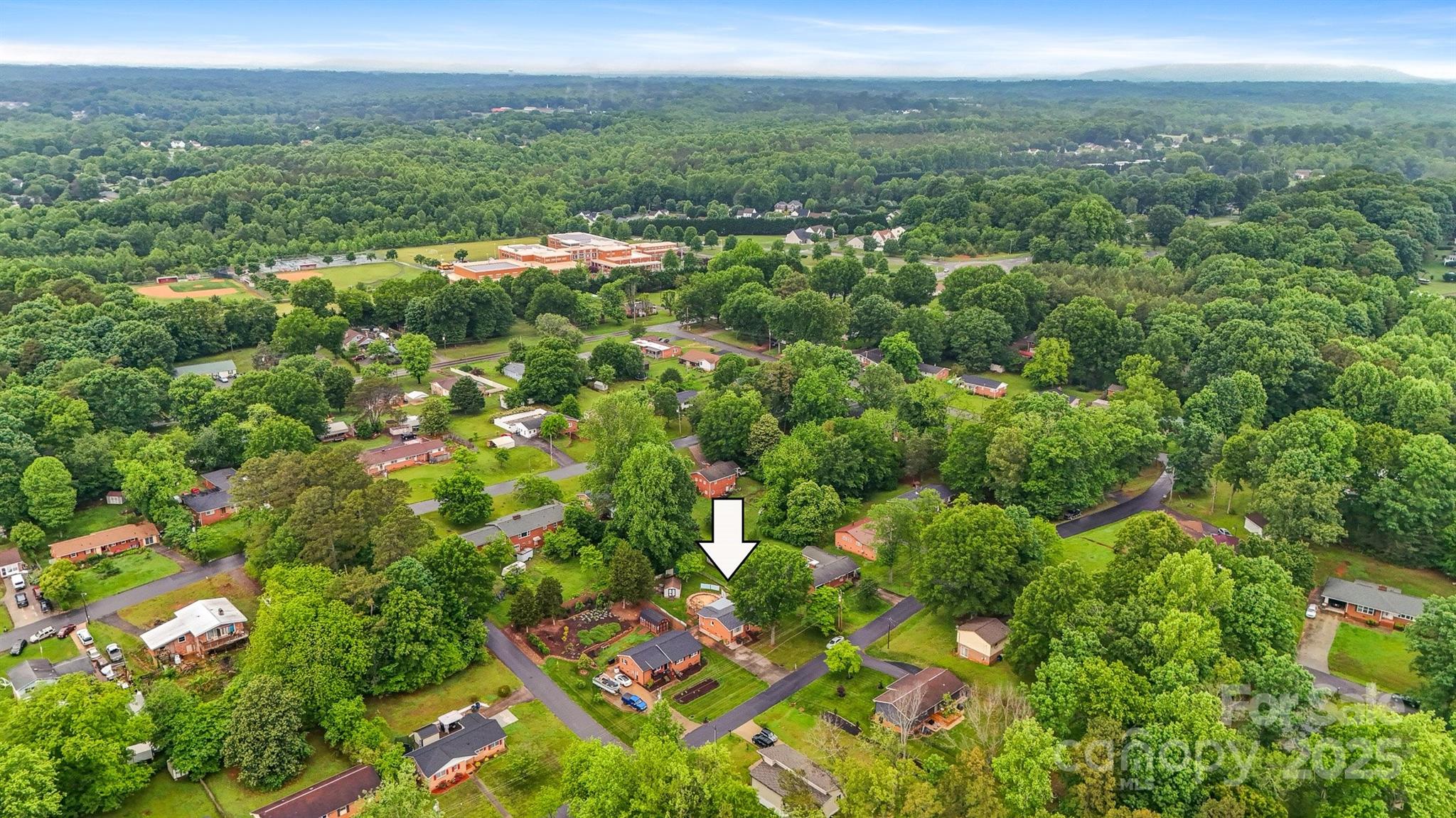 1405 8th Avenue Northwest Conover, NC 28613 - Photo 40 of 41 a view of a city with lush green forest
