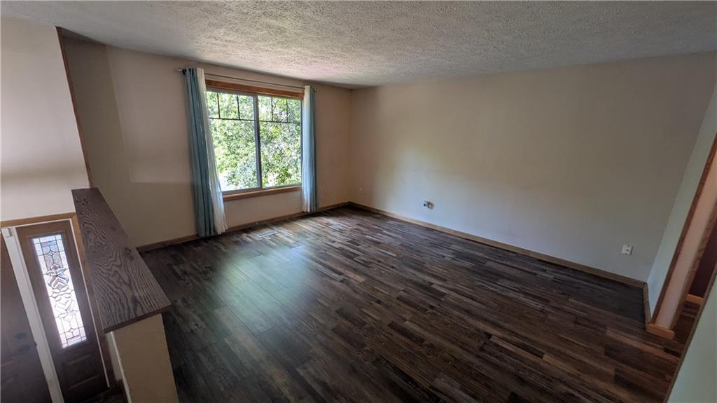 201 Colleen Street Butler, PA 16001 - Photo 15 of 33 a view of an empty room with wooden floor and a window