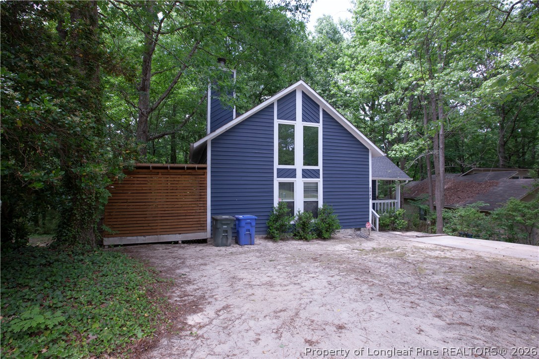5948 Dalton Road Fayetteville, NC 28314 - Photo 3 of 18 a view of a house with backyard and garden