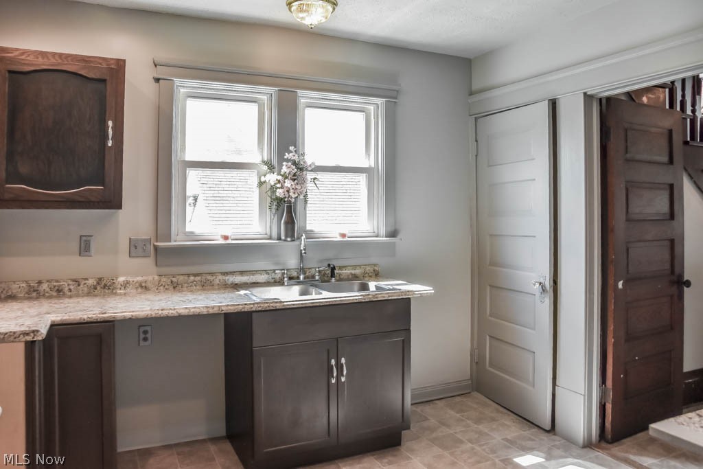 66 South State Street Rittman, OH 44270 - Photo 6 of 26 Kitchen with basement access and new countertops.