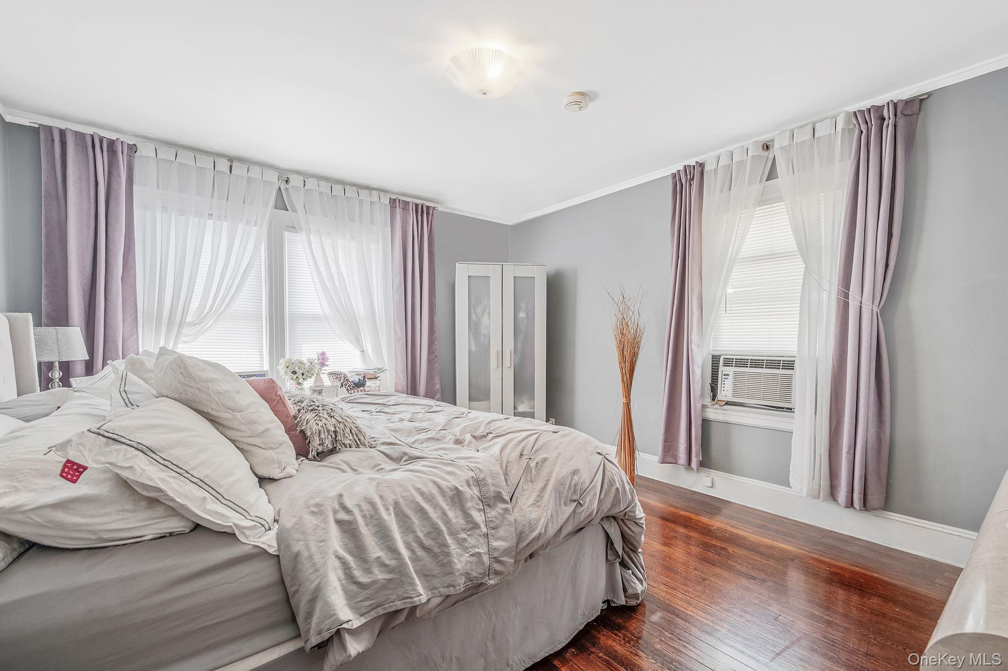 557 Newbridge Road East Meadow, NY 11554 - Photo 19 of 31 a bedroom with a bed and a window