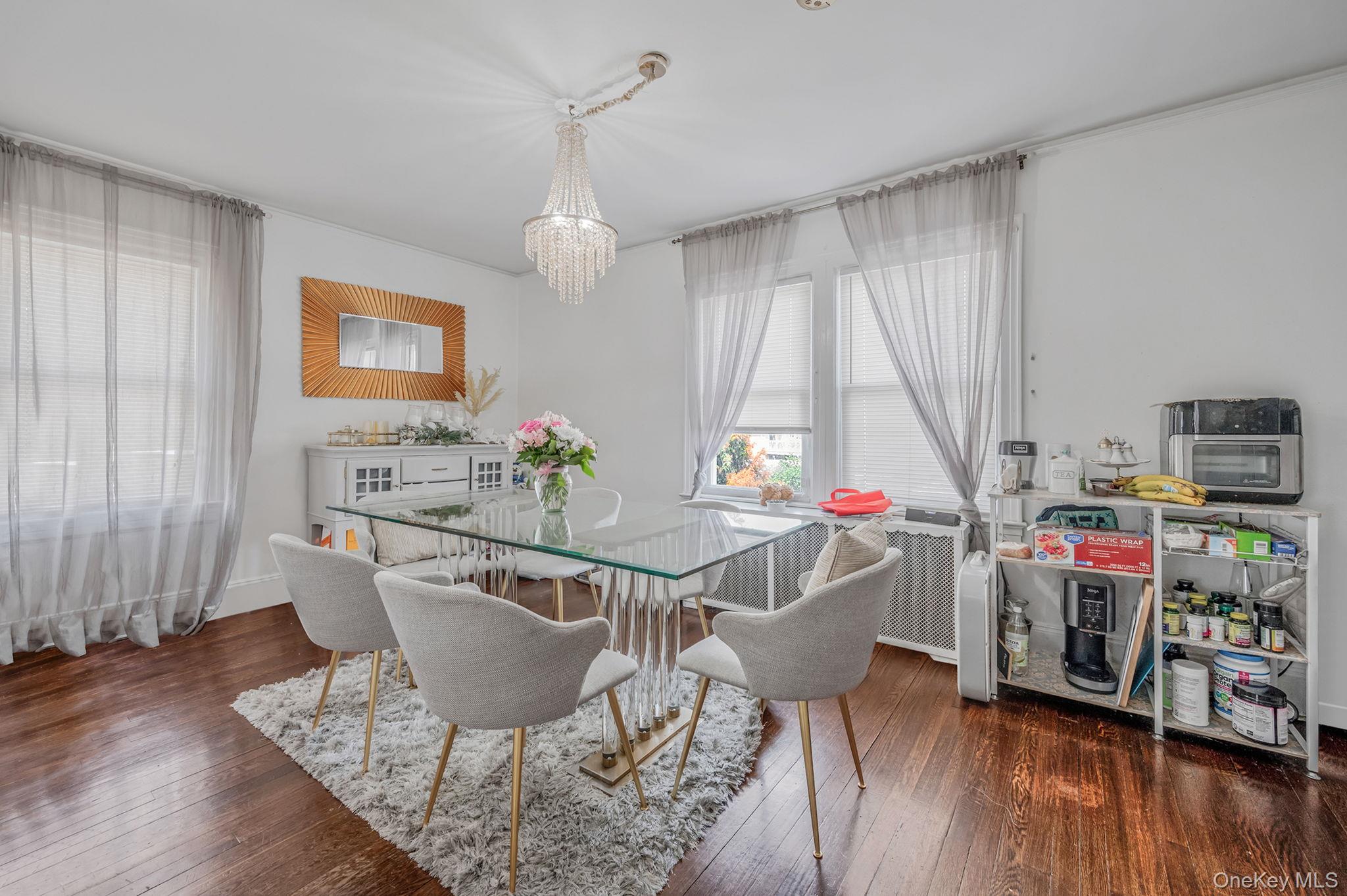 557 Newbridge Road East Meadow, NY 11554 - Photo 20 of 31 a view of a dining room with furniture and wooden floor