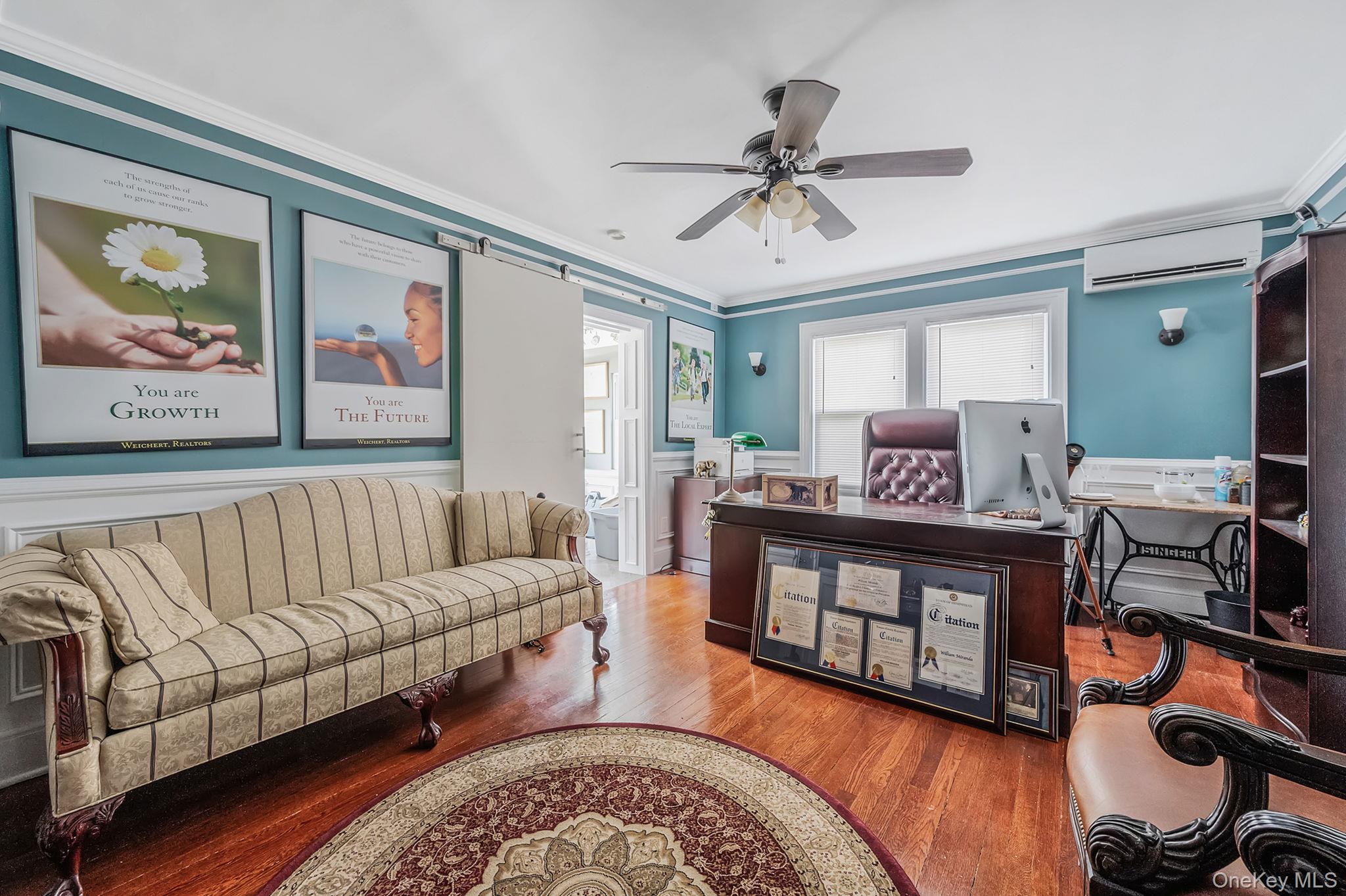 557 Newbridge Road East Meadow, NY 11554 - Photo 28 of 31 a living room with furniture and a wooden floor