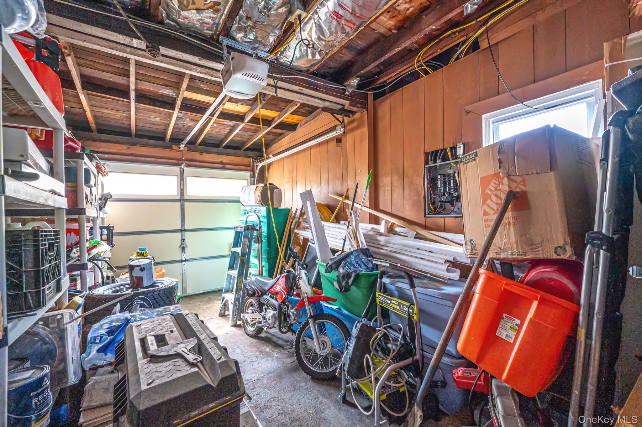 557 Newbridge Road East Meadow, NY 11554 - Photo 31 of 31 a view of a storage room with furniture washing machine and chairs