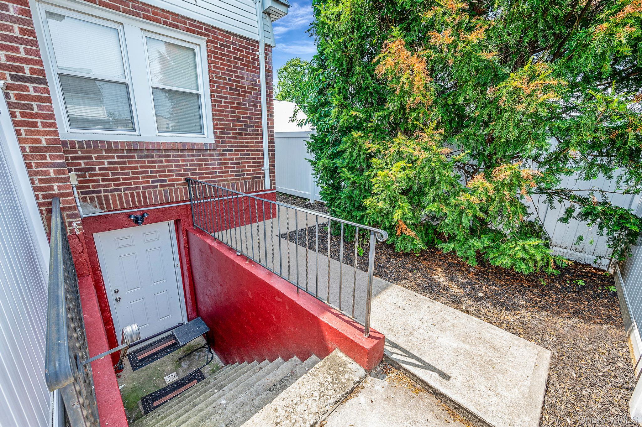557 Newbridge Road East Meadow, NY 11554 - Photo 10 of 31 a view of stairs and a yard