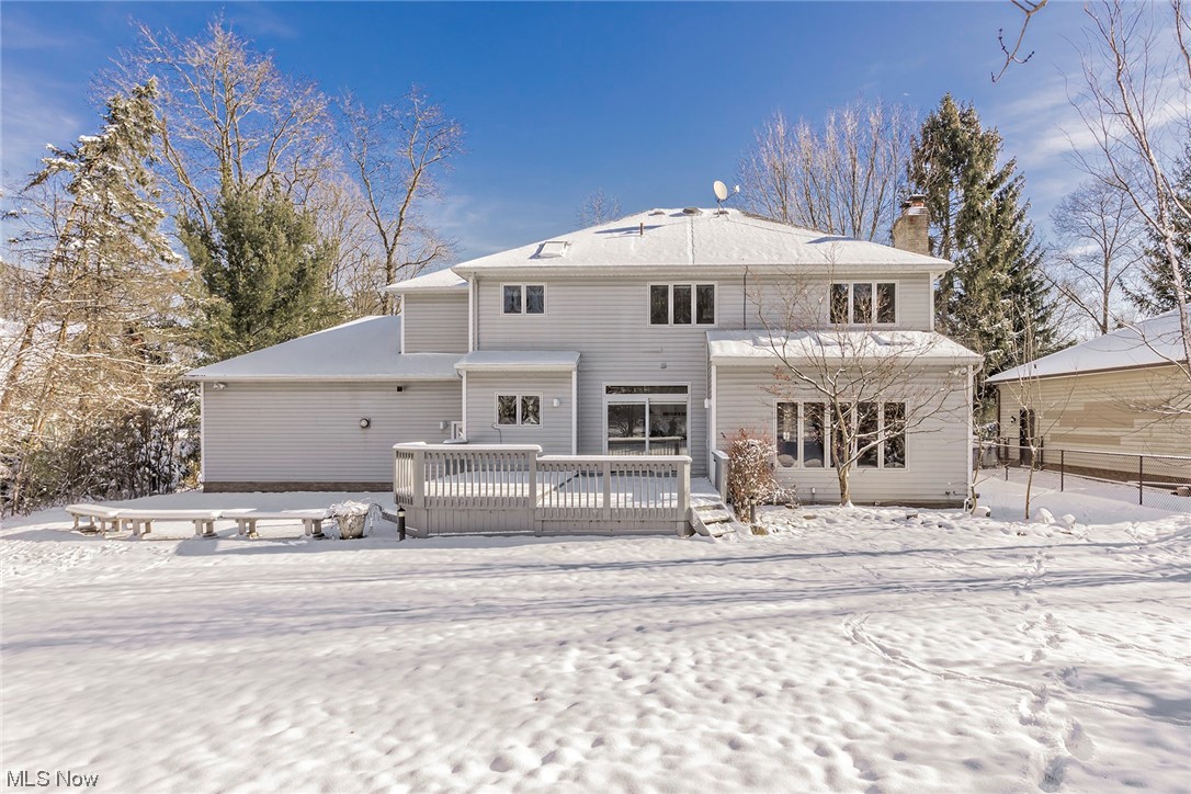 3850 Ellendale Road Moreland Hills, OH 44022 - Photo 39 of 39 View of snow covered rear of property with view of patio off of deck