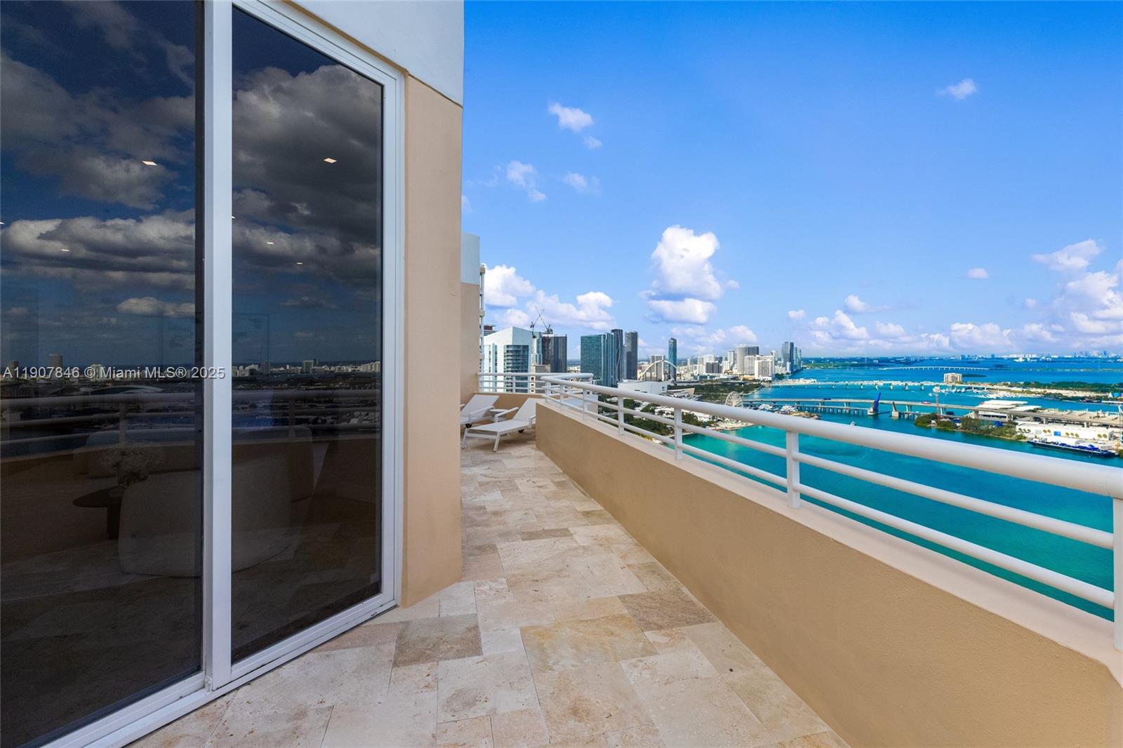 808 Brickell Key Drive, Unit 3901 Miami, FL 33131 - Photo 45 of 72 a view of a living room and kitchen view