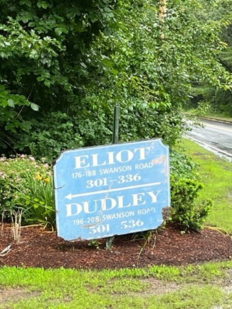202 Swanson Road, Unit 521 Boxborough, MA 01719 - Photo 15 of 16 a sign on the side of the road