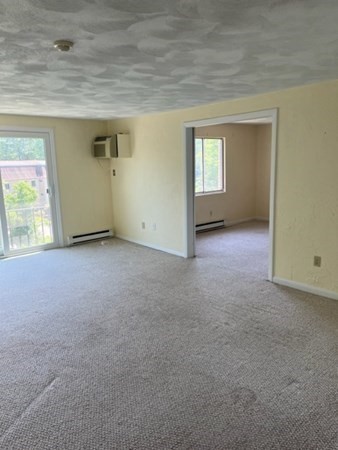 202 Swanson Road, Unit 521 Boxborough, MA 01719 - Photo 5 of 16 an empty room with a window