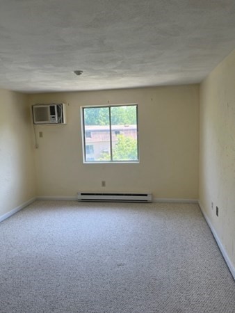 202 Swanson Road, Unit 521 Boxborough, MA 01719 - Photo 8 of 16 an empty room with a window